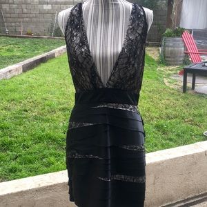 Stunning BEBE layered with satin and lace dress.  Sexy Low deep V cut front.